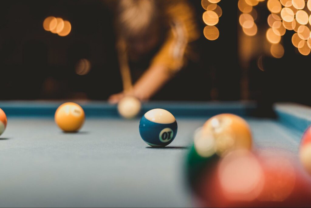 Challenge each other to a game of pool at Pool & Blues.