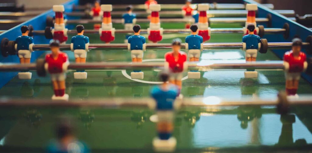 Play the human version of Foosball